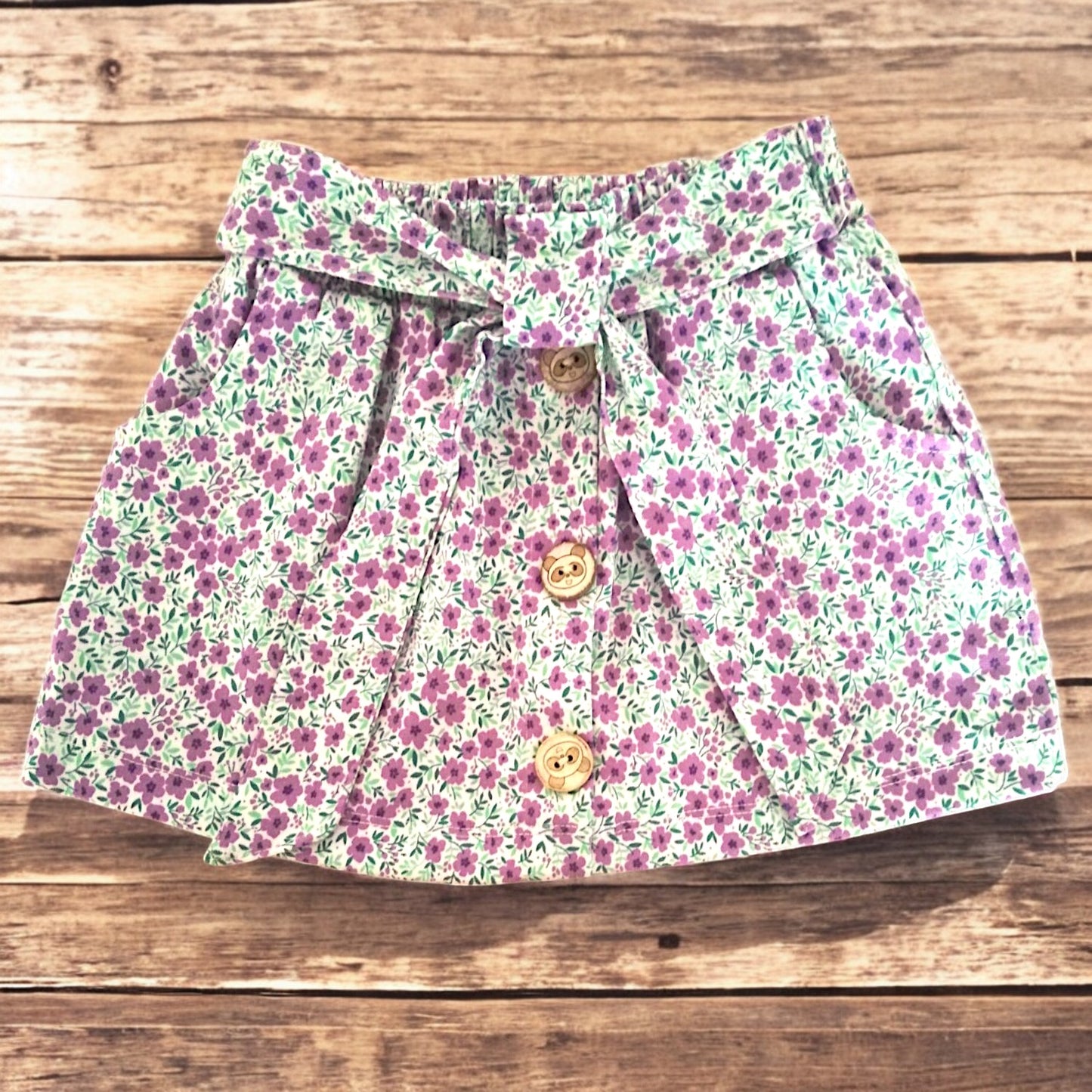 Falda Short Niña Floreado con lazo